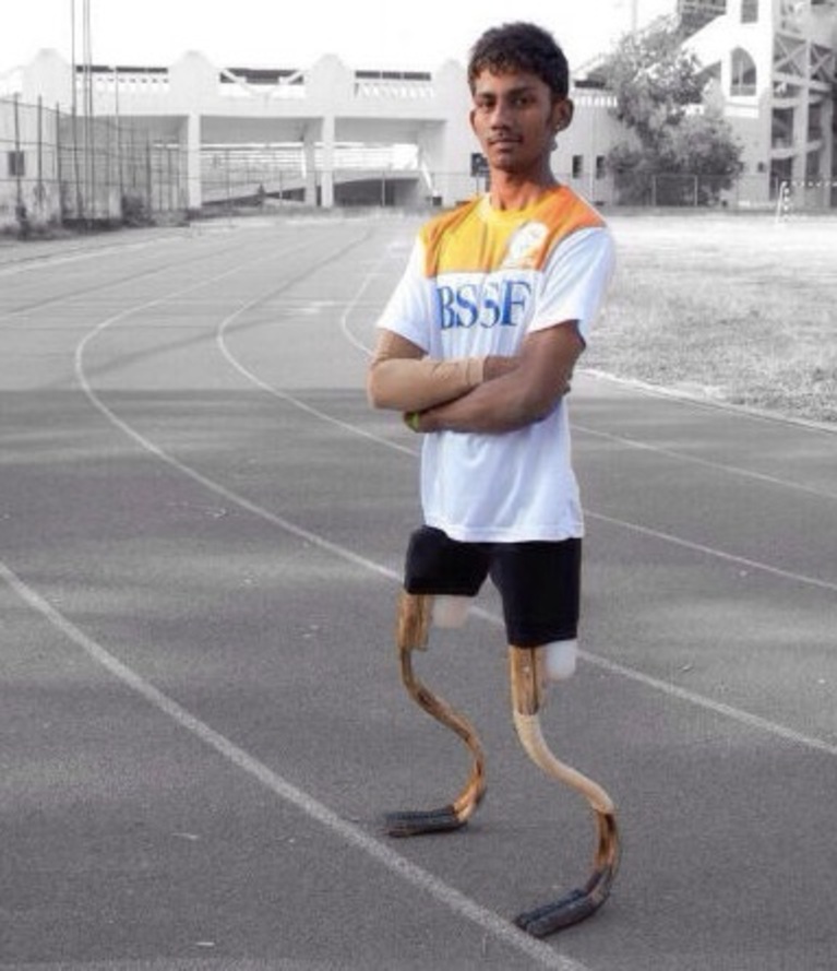 An athlete wears two Rise Legs, standing upright.